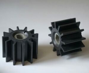Rubber impellers, black flexible vanes, metal hub inserts, used in marine pumps for fluid transfer and cooling systems, close-up product photo.