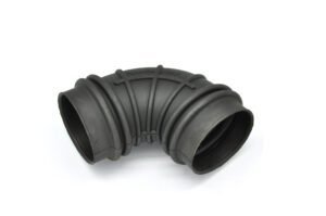 Rubber air intake hose with 90-degree bend, black flexible tubing, ribbed reinforcement, used for automotive engine airflow connection.