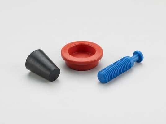 Types of rubber plugs, tapered plug, flange plug and ribbed pull plug shown on a clean white background.