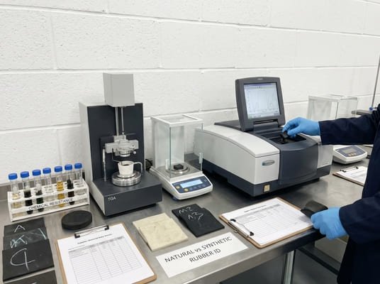 Laboratory setup for identifying natural and synthetic rubber, using FTIR, TGA, sample records, and test sheets for material analysis