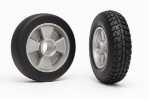 Solid vs pneumatic wheel comparison, black rubber casters with aluminum cores, showcasing tread difference for industrial cart applications.