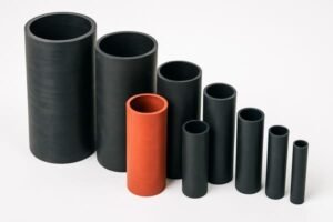 Industrial rubber sleeves in multiple diameters, black and red tubing for protective insulation, arranged in size order on white background.