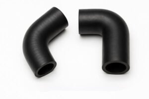 Rubber elbow pipe fittings, two black 90-degree molded hoses displayed on a clean white background, used for fluid transfer in automotive or industrial applications.