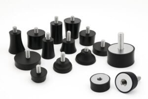 Anti-vibration mounts, assorted rubber isolators with threaded studs and inserts, used for machinery vibration damping, shock absorption, and noise control.