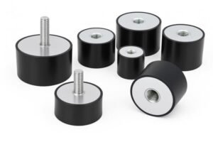 Anti-vibration mounts, cylindrical rubber dampers with threaded metal studs and inserts, used for machinery vibration isolation and noise reduction.