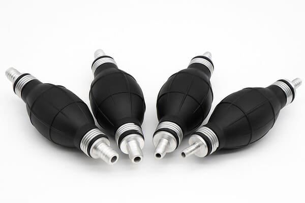Four black rubber oil hand pumps with aluminum hose fittings, arranged on white background, used for fuel transfer in marine and automotive applications.