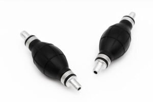 Black rubber fuel primer bulbs with aluminum hose fittings, marine and outboard engine fuel transfer pump accessories, isolated on white background.