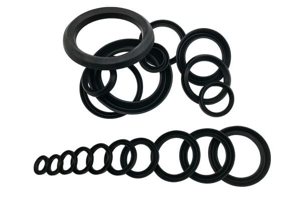 Assorted black rubber V-ring seals in various diameters, arranged in circular stacks and a linear size sequence, displayed on a white background for size comparison and selection.