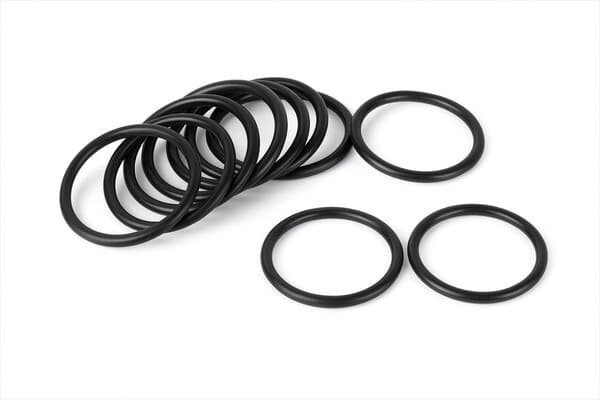 HNBR rubber O-rings in black, neatly arranged on white background, durable sealing components resistant to oil, fuel, and high temperatures.