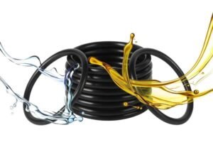 HNBR rubber O-rings in black, arranged in a coil with dynamic splash of water and oil, illustrating high resistance to oil, fuel, and hydraulic fluids.