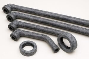 Rubber hose blooming, molded elbow hoses and gasket with whitish powdery surface, on white background, quality inspection defect example.