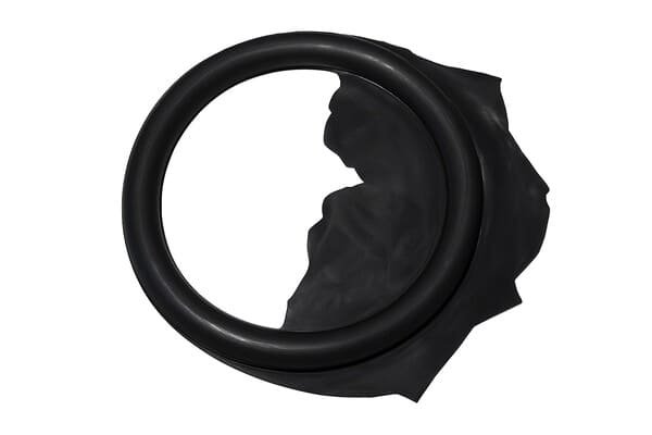 Black rubber gasket showing short shot and flash molding defects 