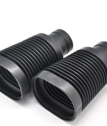 Rubber bellows for machinery, black corrugated design, flexible dust cover, industrial protection component, shown upright and lying down.